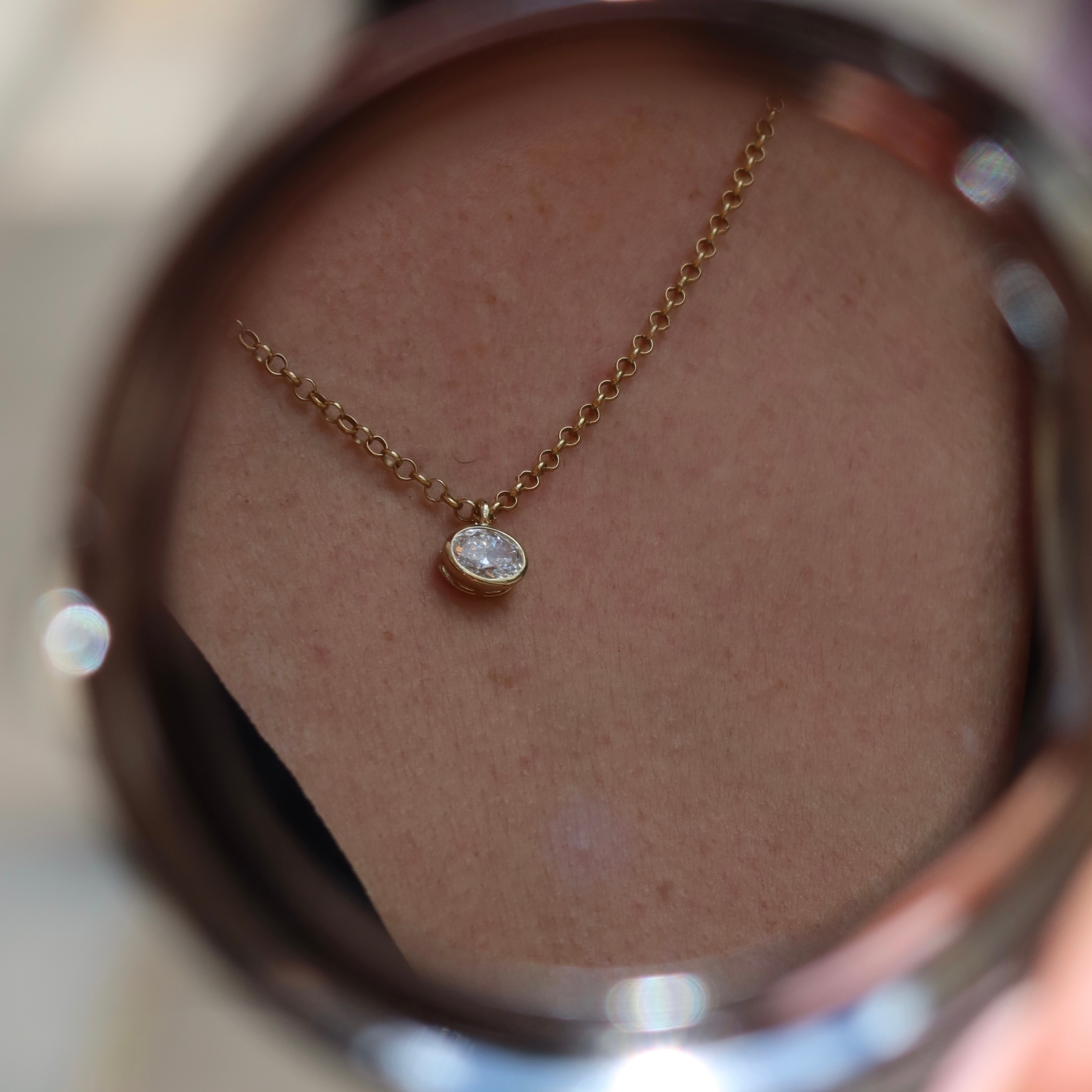 oval diamond pendant with gold chain