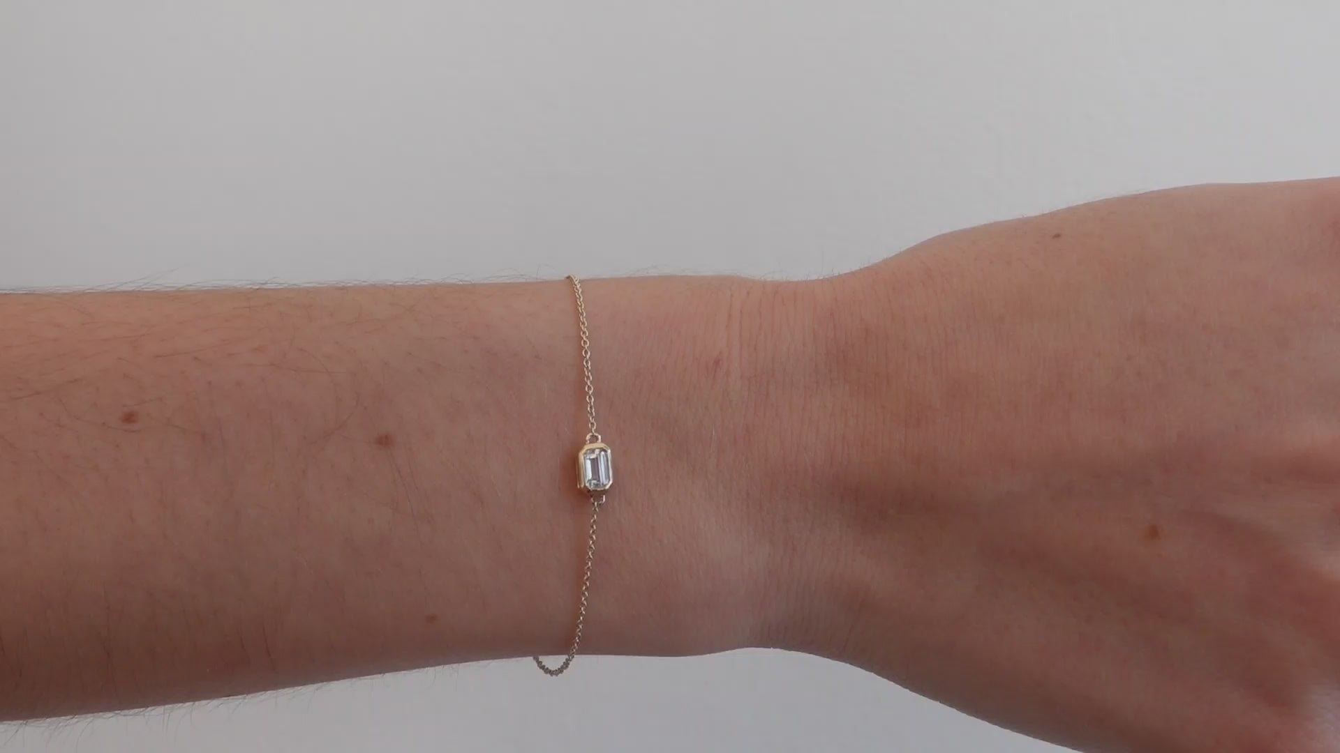 dainty solid gold bracelet with white sapphire