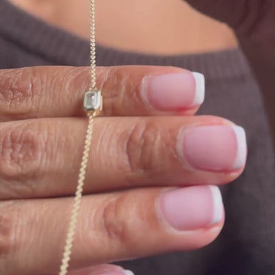 dainty solid gold bracelet with white sapphire